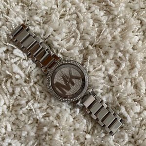 Michael Kors silver watch. Has crystals around the edge.